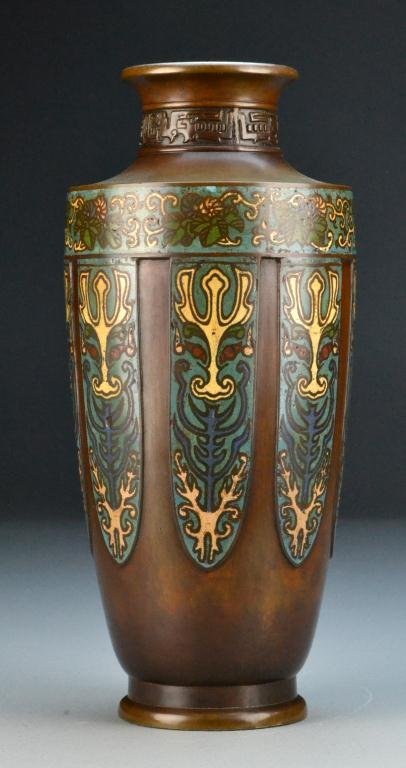 Chinese Qing Bronze And Champleve Vase: Finely enameled on down turned lapets depicting the face of the beast, with two character seal mark to underside, 12" H, circa 19th century. Property Of A Ray Township, Michigan Gentleman.