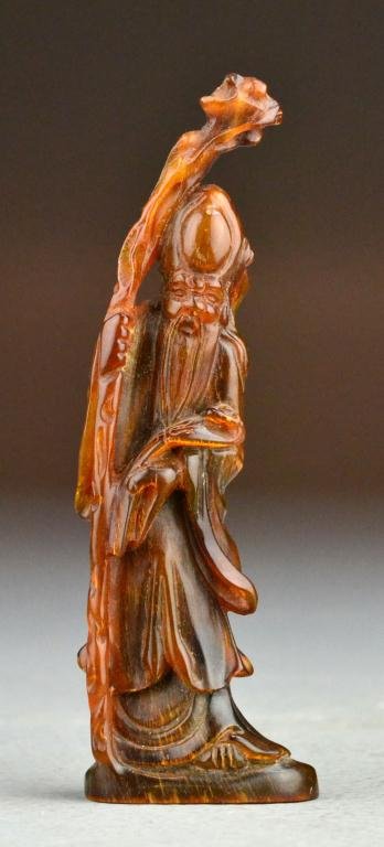 Chinese Republic Period Horn Carving Figure: Finely carved to depict Shilo holding long staff and ruyi scepter, measures 5"H. Property of a Holly MI Gentleman.