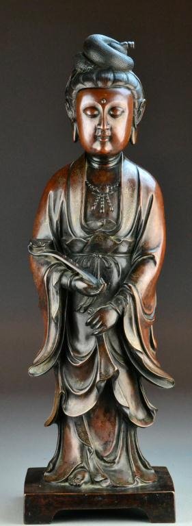 Large & Impressive Chinese Bronze Statue: Finely cast to depict a standing Guan Yin holding a ruyi scepter, the bronze with silver inlay, apparently unmarked, 23"H, circa late 19th century or earlier. Property of a Harper Woods Michigan Gentl