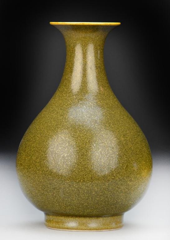 Chinese Tea Dust Porcelain Vase: Of bottle form with flared rim and tea dust glaze, raised on short foot ring, the base bearing impressed Dao Guang seal mark Private collection Rochester Hills Michigan.