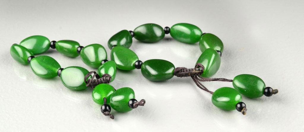 Pr. Chinese Jade Bead Bracelets: Each consisting of nine oval shaped jade beads of dark green color with fine polish, 3.5"D outside, 2.25"D inside. Private collection Rochester Hills Michigan.