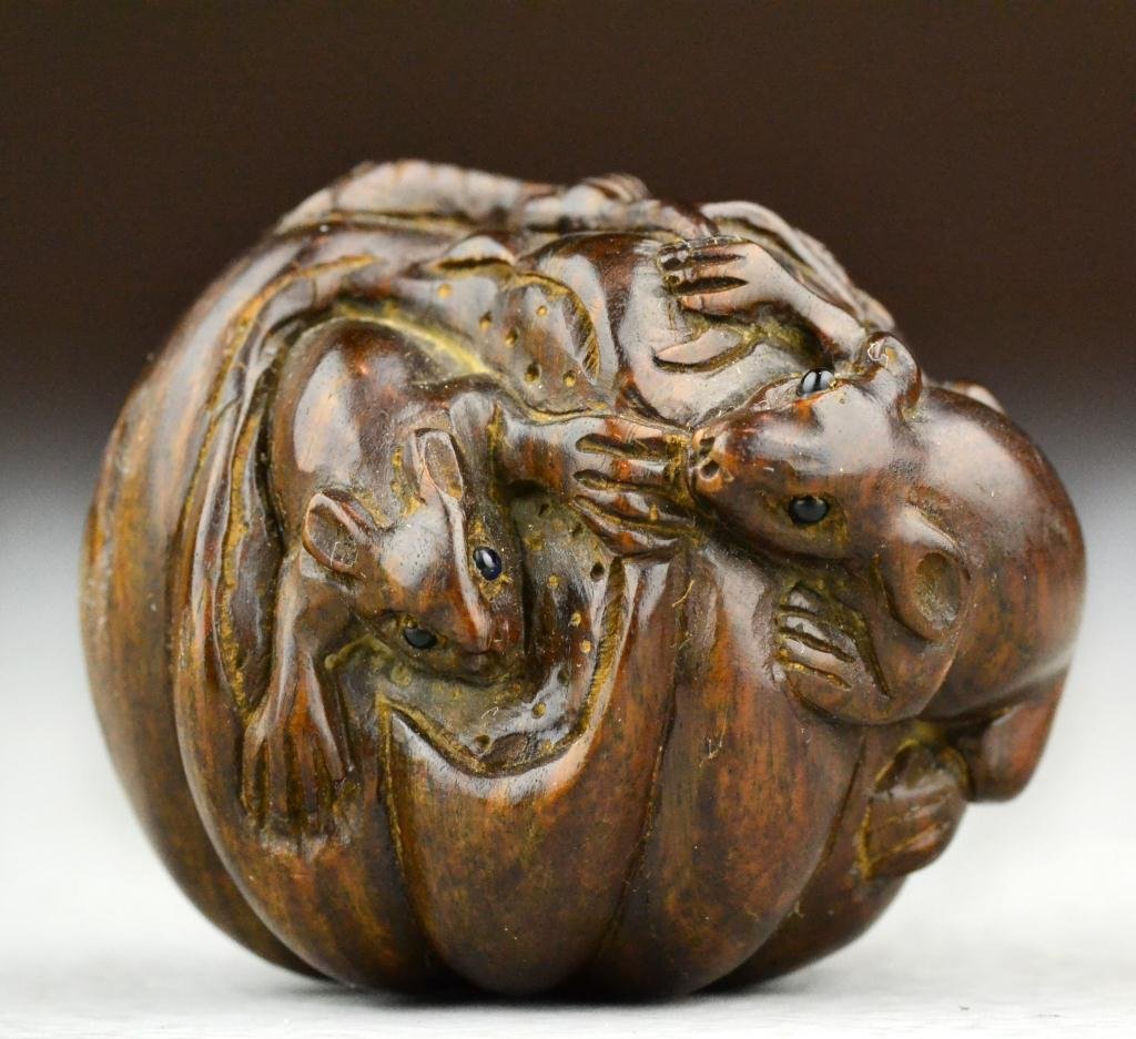 Japanese Meji Period Carved Wood Netsuke: Finely carved with great attention to detail to depict two mice eating a pumpkin, with character mark within a small circle, 1.5"H X 1.75"W. Property of a Holly MI Gentleman.