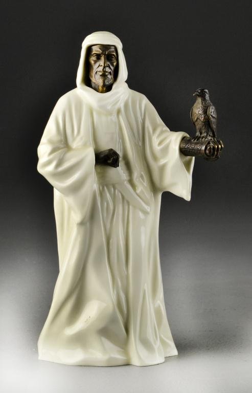 Minton Porcelain & Bronze Sheikh with Falcon: A finely molded sheikh with hand outstretched holding a falcon, with bronze face, hand and bird, 10" H, circa early 20th century. Property from Ethel Miller Siegel Trust, Bloomfield Hills, Michigan.