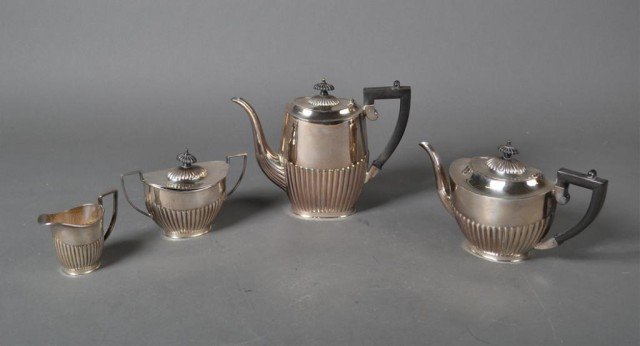 (4) Piece Old Sheffield S.P. Coffee & Tea Service: Art deco tea service comprising a teapot, coffee pot, covered sugar bowl and cream jug, the coffee pot and teapot with with Bakelite handles all hallmarked Sheffield, England, tallest measures 8.25" H