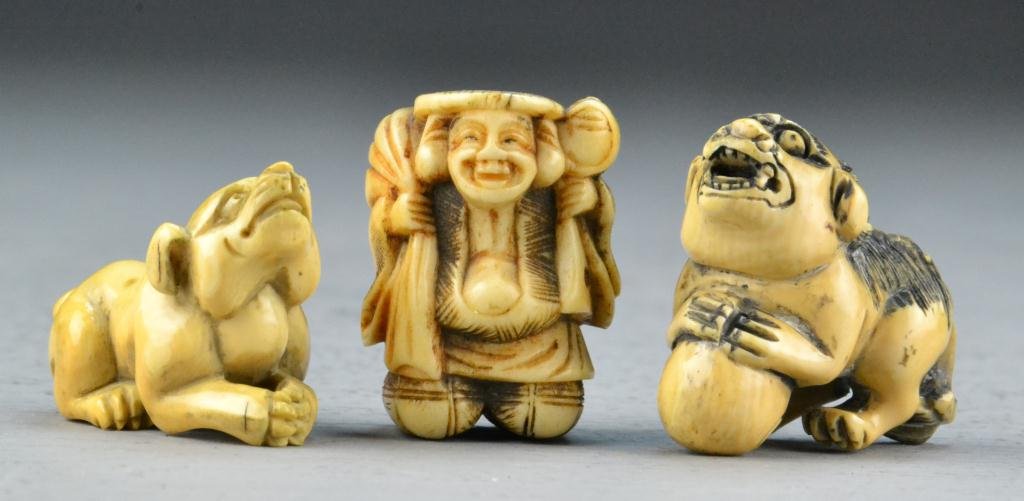 (3) Japanese Netsukes - Ivory and Bone: To include 2 ivory and 1 bone, dog, Foo Dog and elder, largest is 1.25" H, circa late 19th century. Condition: good. Private collection of a Decker, Michigan, gentleman.