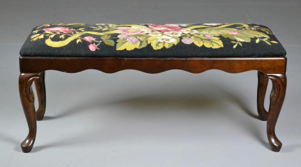 Queen Anne Style Walnut Hall Seat: Having carved knees raised on Queen Anne feet and having a floral needlepoint seat, 42" W x 17" H, circa 20th century. Condition: good. Property of Sena Bowling, Davison, Michigan.