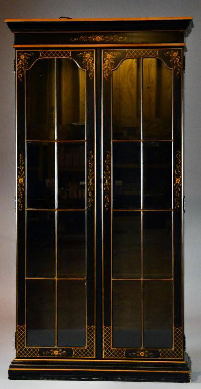 Ethan Allen Painted Two-Door Display Cabinet: With two wood-framed glass doors opening to a shelved interior, the whole chinoiserie-decorated against a black ground, lighted, 77.5"H x 37"W x 12.75"D, circa 20th century. Important West Bloomfield