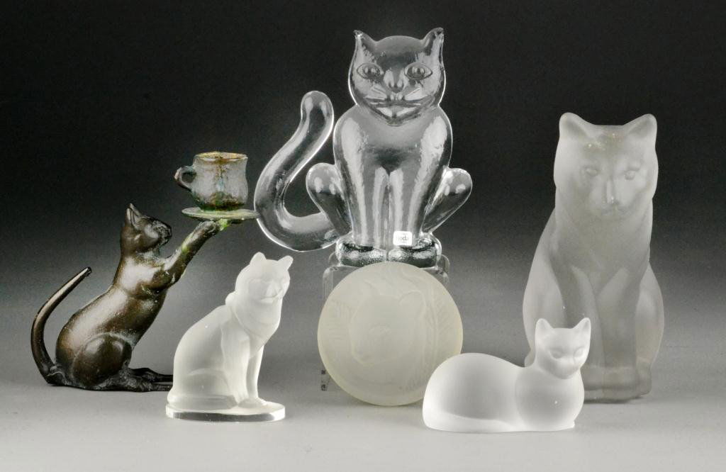 (7) Glass And Spelter Cat Figures Inc. Orrefors: To include glass and spelter cat figures in various positions, some signed include: Boda Sweden, Lenox and one signed illegibly Kra?, and one signed Orrefors, along with spelter cat teacup candlestick
