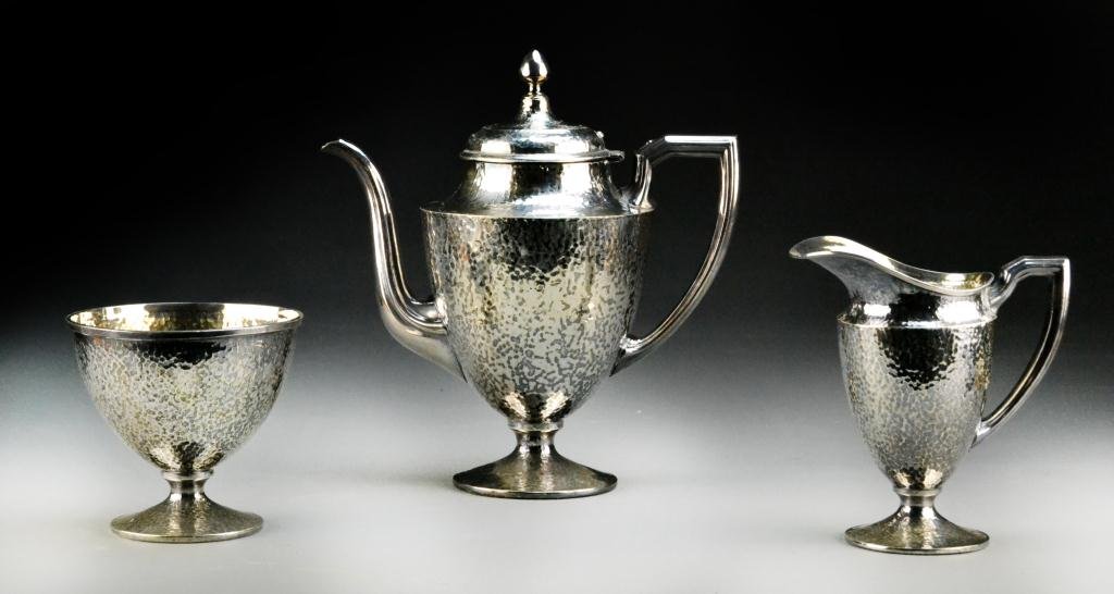 (3) Pc. Poole Silverplate Hammered Tea Set: Federal style teapot, cream and sugar, each piece with hand-hammered finish, tallest is 10" H, marked to bottom with tag 'Poole Silver Co., Taunton, Mass, 9111 Hand Hammered' and scribed 146, circa ea