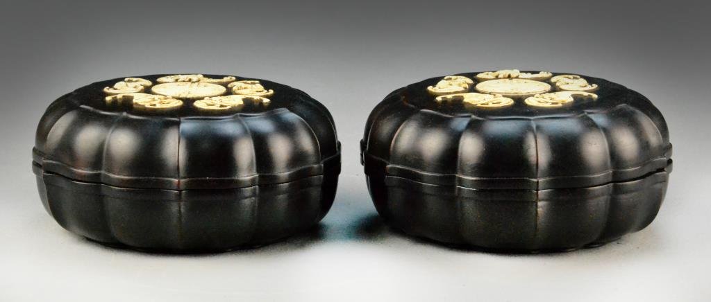 Pr. Chinese Zitan Wood & Ivory Appliqued Boxes: Carved to represent lotus leaves, with five appliqued ivory bats with a central ivory longevity symbol, base bearing incised four character Qianlong mark, 2.5"H X 5.5"D. Private collection Portland Or
