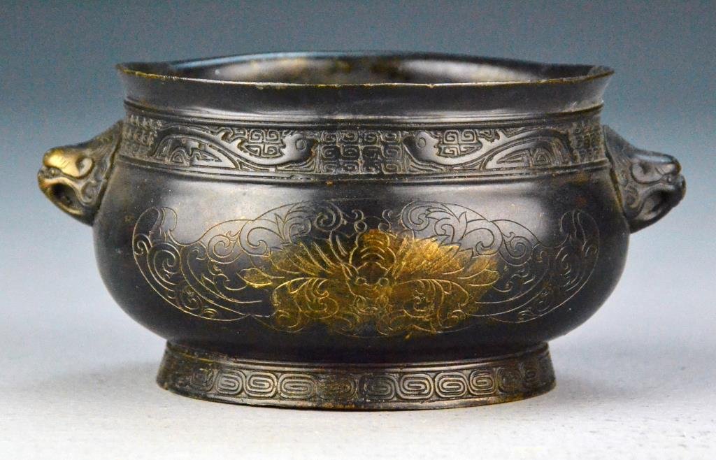 Chinese Bronze Censer: Finely molded to depict bats, with two dragon head handles, raised on short foot ring, base bearing four character seal mark impressed, 2.75"H X 4"D. Property of a Traverse City Michigan Gentleman.