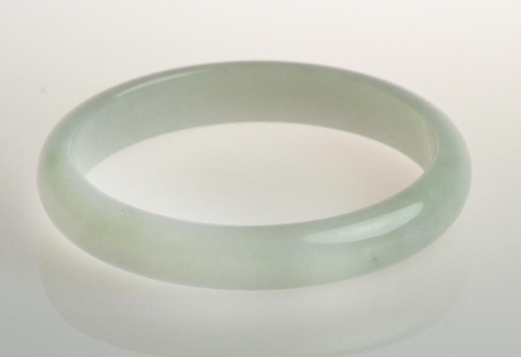 Chinese Mutton Fat Jade Bangle Bracelet: With fine carving and polish, the stone an even mutton fat color, outside diameter 2.875", inside diameter 2.375", circa late 19th/early 20th century. West Bloomfield Michigan Collection.