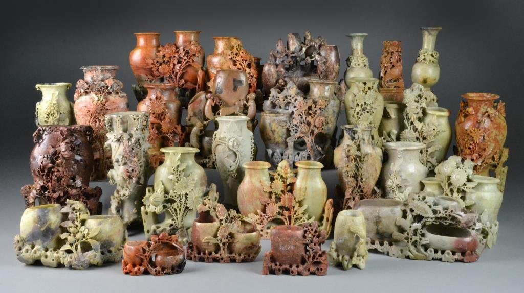 (28) Large Chinese Carved Soapstone Vases: Twenty-eight large intricately carved soapstone vases, carved to depict flowers, animals, and fruit, largest measures 11"H.