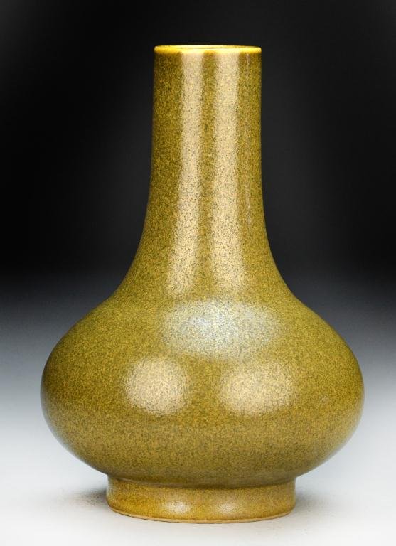 Chinese Eel Skin Porcelain Vase: Of bottle form with eel skin glaze, raised on short foot ring, the base bearing impressed Dao Guang seal mark, 8.25"H. Private collection Rochester Hills Michigan.