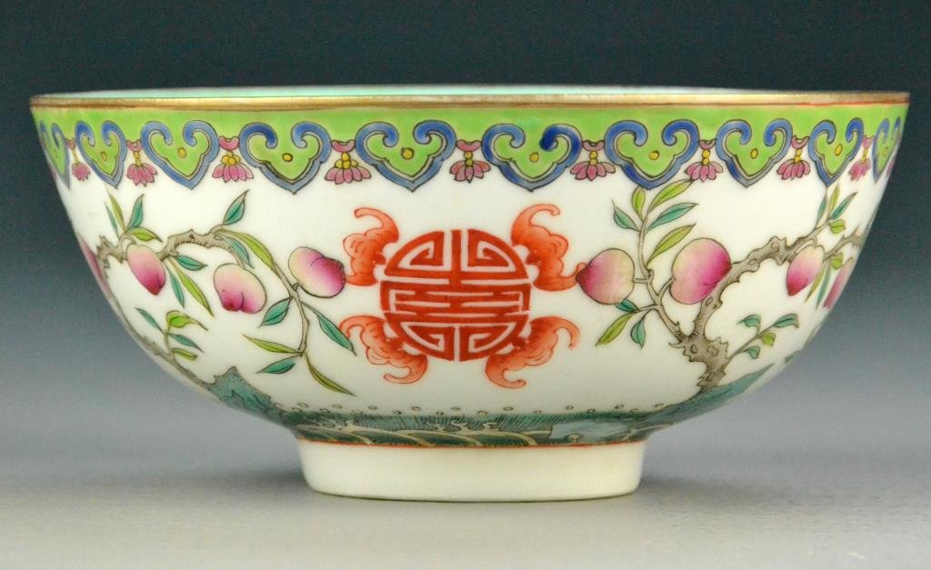 Chinese Famille Rose Porcelain Peach Bowl: Finely enameled with peach tree decoration, three longevity symbols with bats and waves to base of bowl on white ground, aqua glaze to interior and bottom, underglazed iron red Qianlong sealmark to bo