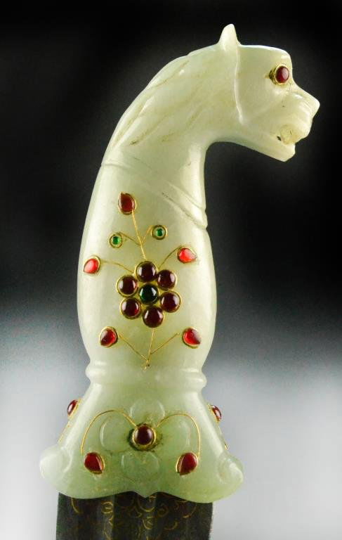 Chinese Qing Mughal Style Jade Handled Dagger: Carved as the head of a dragon, with gold metal thread and semi-precious stones, jade handle measures 5.5"L, 15.5"L overall, circa late 19th/early 20th century. Property of a Houston Texas Gentleman.