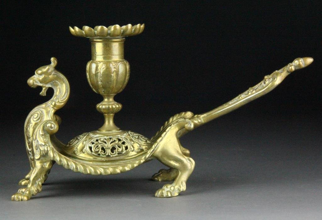 Chinese Qing Figural Candle Stand: Finely molded to depict a standing dragon with realistic details, his back holding a candle stick, 9"L, circa 19th century. Condition: With polish residue otherwise excellent. Private collection, West