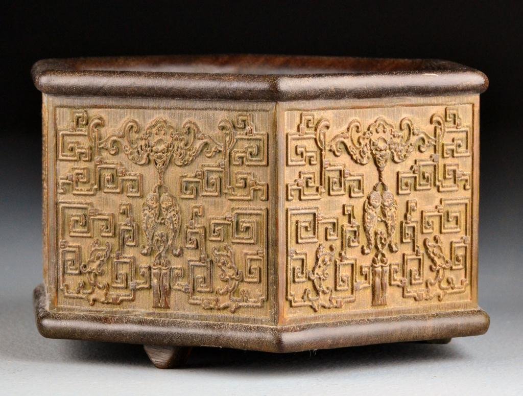 Chinese Carved Wood Brushwash: Of hexagonal shape finely carved to depict bats and archaic designs, raised on three sort feet, 4"H X 7"D. Private collection Rochester Hills Michigan.