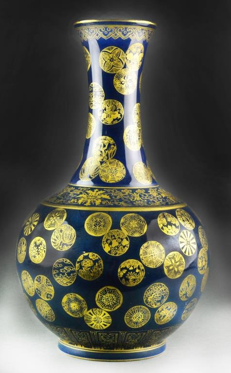 Chinese Qing Blue and Gilt Decorated Porcelain Vase: Depicting bats and symbols in gilt against a cobalt ground, six-character Kangxi mark in gilt to bottom , 15.5"H.Condition: good. Property of Birmingham, Michigan, gentleman.