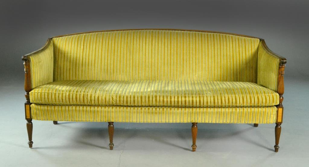 Cocheo Brothers Inc. Sheraton-Style Mahogany Sofa: Having striped velvet upholstery with brass tack decoration, carved scroll arms above reeded and turned legs, 76" L x 35" H x 21" D, circa 20th century. Condition: minor scratches on crest, otherwise 