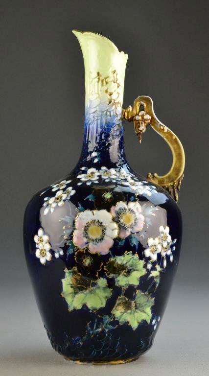 R.St.K Turn Teplitz Porcelain Amphora Vase: Riessner, Stellmacher & Kessel Bavarian porcelain urn with floral decoration and gilt rim and handle, 16.5" H, circa late 19th century. Condition: wear to gilt on handle, otherwise good condition. Pro