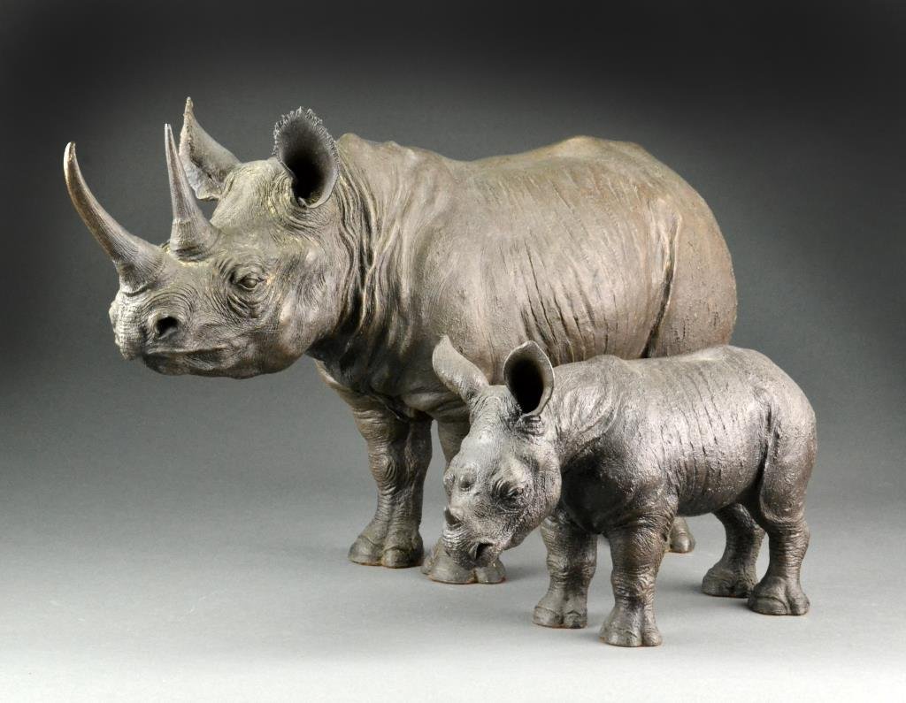 (2) B. Thompson Composition Rhinoceros Sculptures: Depicting a very detailed mother Rhinoceros and her calf both in standing position, sculptures are of high quality and very heavy. Mother Rhinoceros signed on belly B. Thompson and numbered 57/300, ca