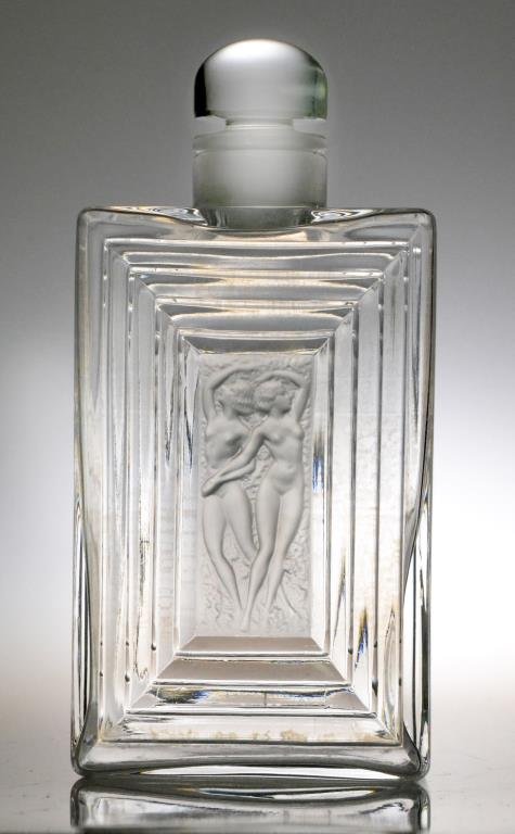 Lalique "Duncan" Decanter: Depicting two etched nude beauties on front and back of rectangular decanter with rounded stopper, signed to bottom 'Lalique, France' in block letters, 8" H, circa mid-20th century. Condition: good. T
