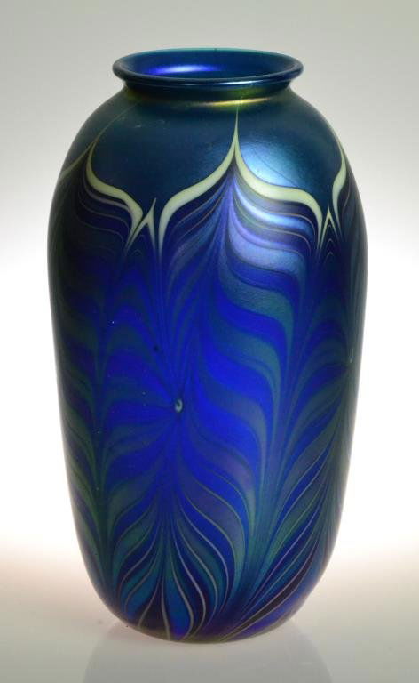 Orient & Flume Signed Irridescent Feather Vase: Irridescent blue and purple feathered glass vase, signed 'Orient & Flume,' signed (?), 8.5" H, dated 1982 to bottom. Condition: good. Trust of Ethel Siegel, Bloomfield, Michigan.