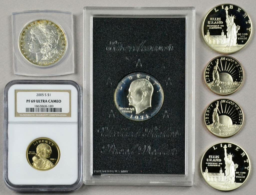 (7) 1878 Silver Dollar & Liberty & Sacagawea Proof Co: To include an 1878 AU 50 Morgan silver dollar, a $1, 2005 S Sacagawea, PF 69 ultra cameo, two sets of United States Liberty 1986 S coins including an Ellis Island Liberty dollar & half dollar, a Eisen