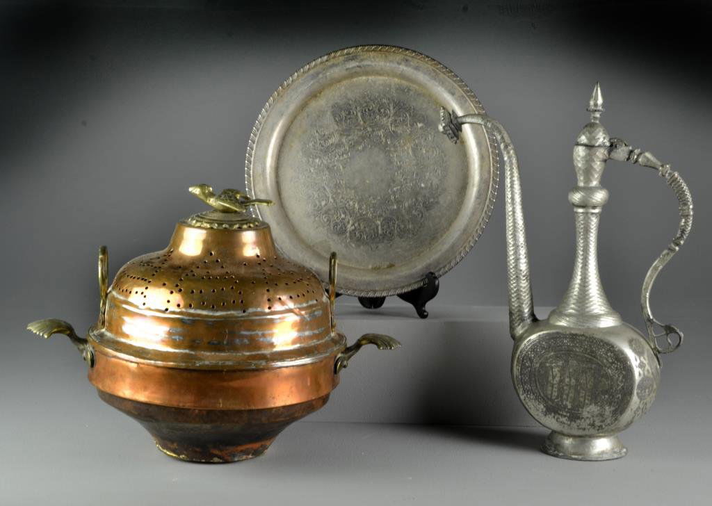 (3) Antique Islamic Articles Including Metal Ewer: To include a Islamic ewer with engraved symbols and figures, a copper and brass Brazier with shell form handles and large bird finial and a silver-plate serving tray with interior scroll design, large