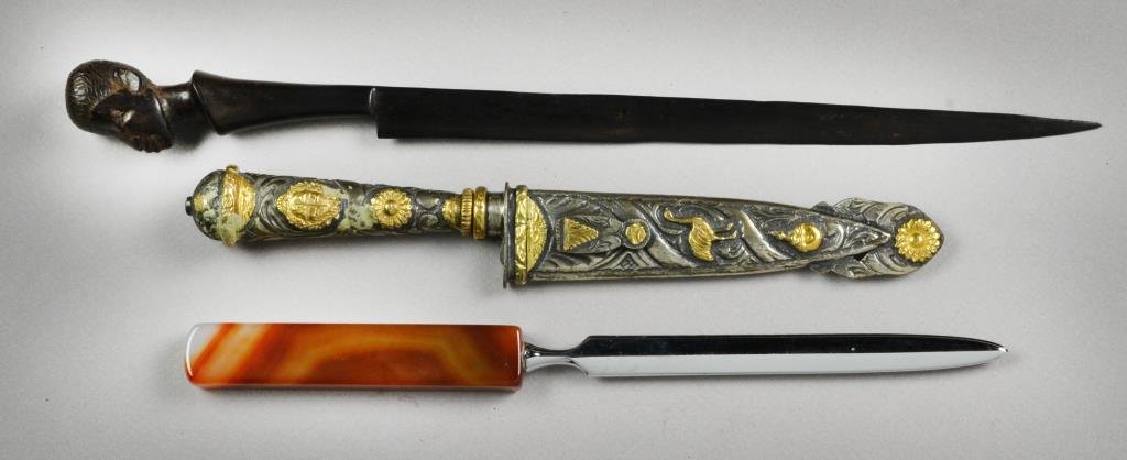 (3) Wood Stone And Silver Letter Openers: To include a finely carved African hardwood example, an agate handled example finely polished, together with an edged weapon and sheath possibly silver with gold appliques, largest is 11.5"L, circa ea