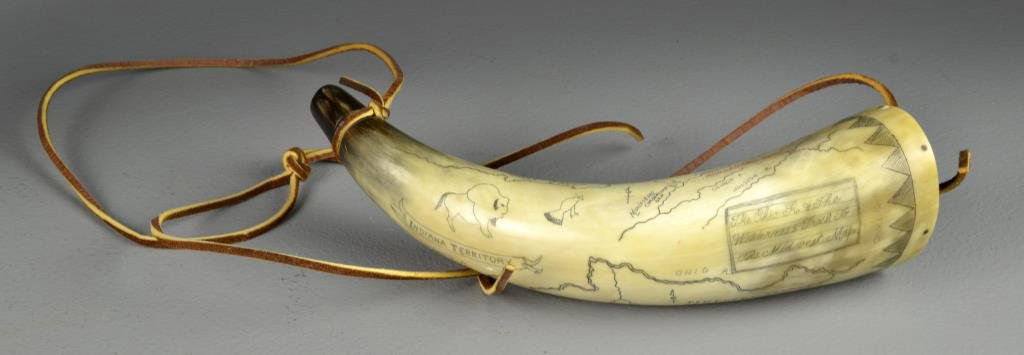 A Finely Carved American Powder Horn: Carved depicting Kentucky County of Virginia, The Indian territory, with teepees buffalo, deer, and presented to Edith Peede February 6th 1981. 10"L and very well carved. Private collection Dearborn,