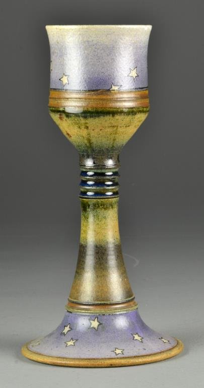 An Erotic Pottery Cup: The interior of the cup with molded nude, the exterior decorated with stars in multicolored glaze, signed BB? And dated 1975, 12.5"H. Condition: Very small nic to rim on cup. Provenance: Formally in t