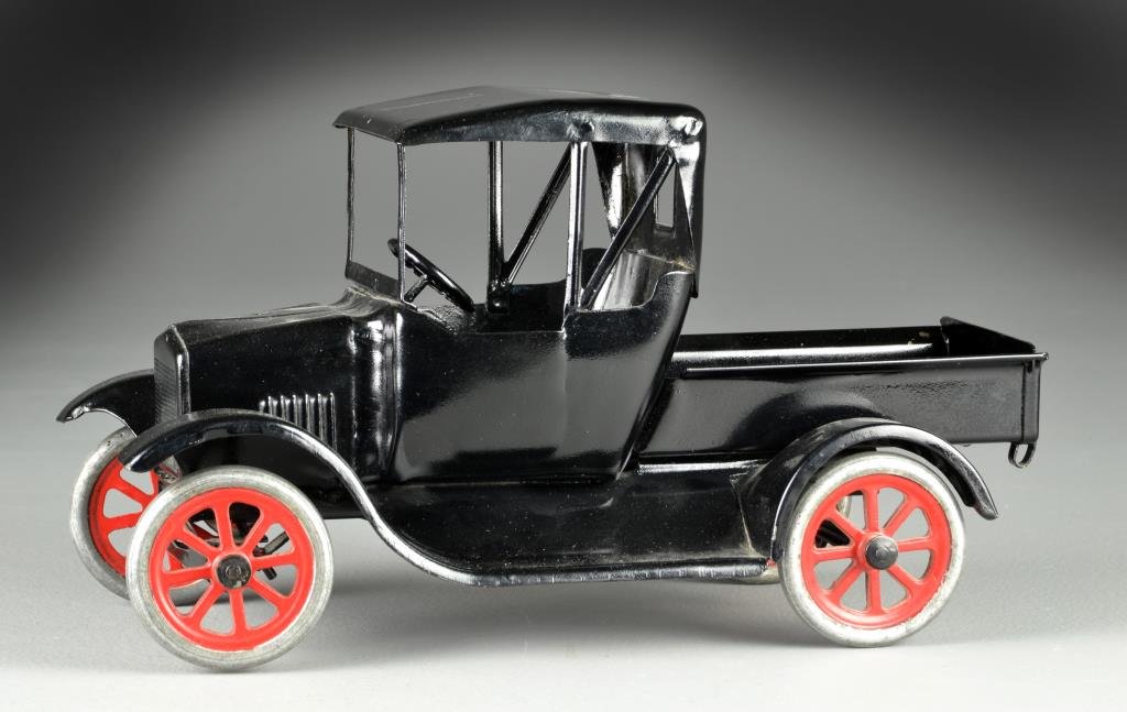 Buddy L Flivver #210 Pick Up Truck: Pressed steel straight line truck, 12"L, circa early 20th century. Condition: Excellent with three small areas of paint loss one measuring .25" to .50" behind passenger door and two measuring .50"and 