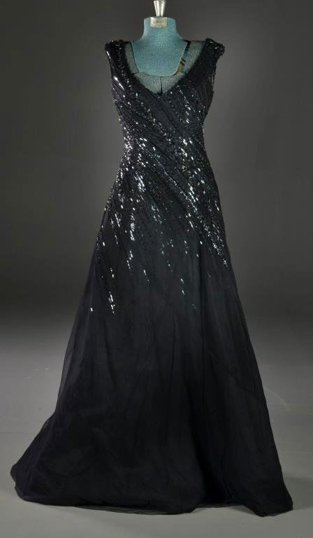 Escada Black Beaded Evening Gown: Deep V neckline tooled dress with heavey bead and sequin design on upper portion of dress, A- line bottom, size 34, Made in Germany. Condition, very fine. Property of a Metamora, Michigan lady & gentl