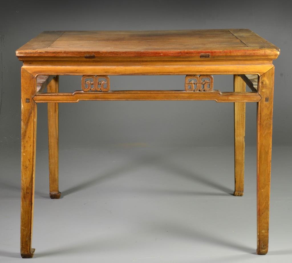 A Chinese Qing Wood Table: Possibly huanghuali wood, having carved elements and tapered legs,pegged construction, 33" H x 40" Square, circa 19th-early 20th century. Condition, lacking four carvings, overall wear and area of sta