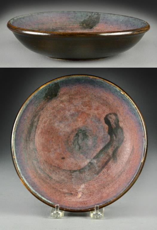 Toshiko Takaezo Stoneware Bowl: Having decoration of what appears to be dragon head to the interior of the basin with multi-colored glaze, signed to foot rim, 7.75"D X 2"H. Provenance: Formally in the collection of Gary Culpepper of