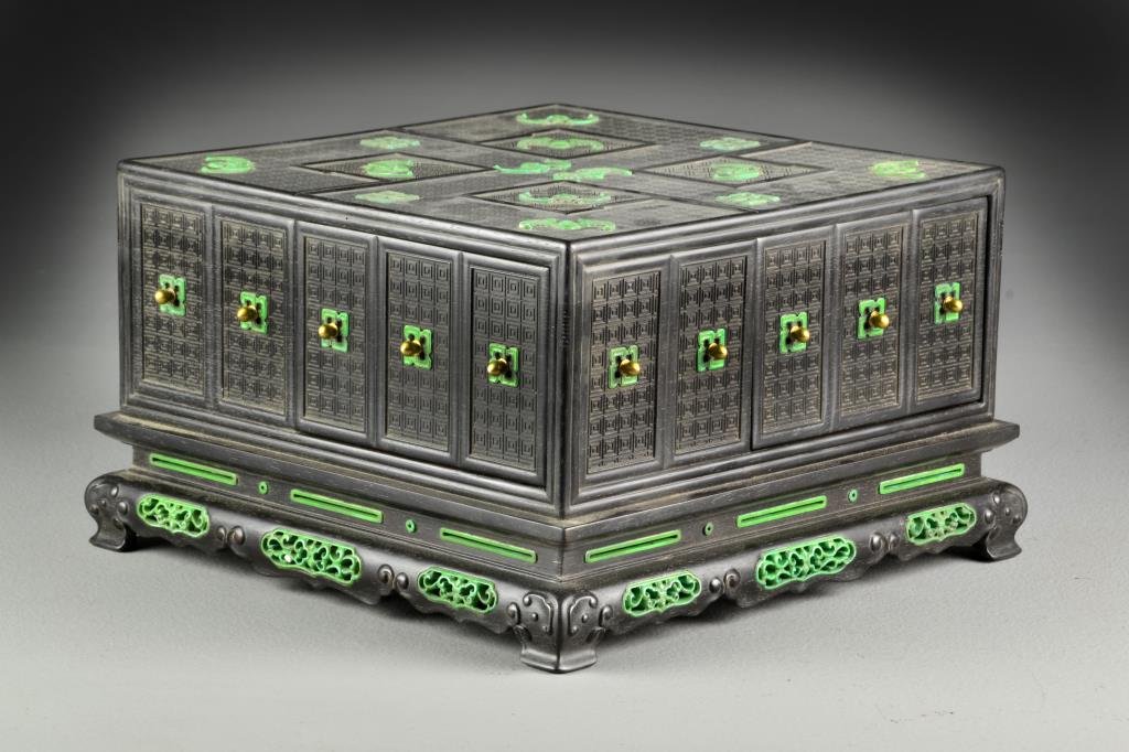 A Fine Chinese Ivory Inlaid Zitan Snuff Box: Having four drawers and four faux drawers, inlaid with dyed ivory bats, Shou symbols, and finely carved ivory open work inset medallions, having gilt brass drawer knobs, raised on four finely shaped f