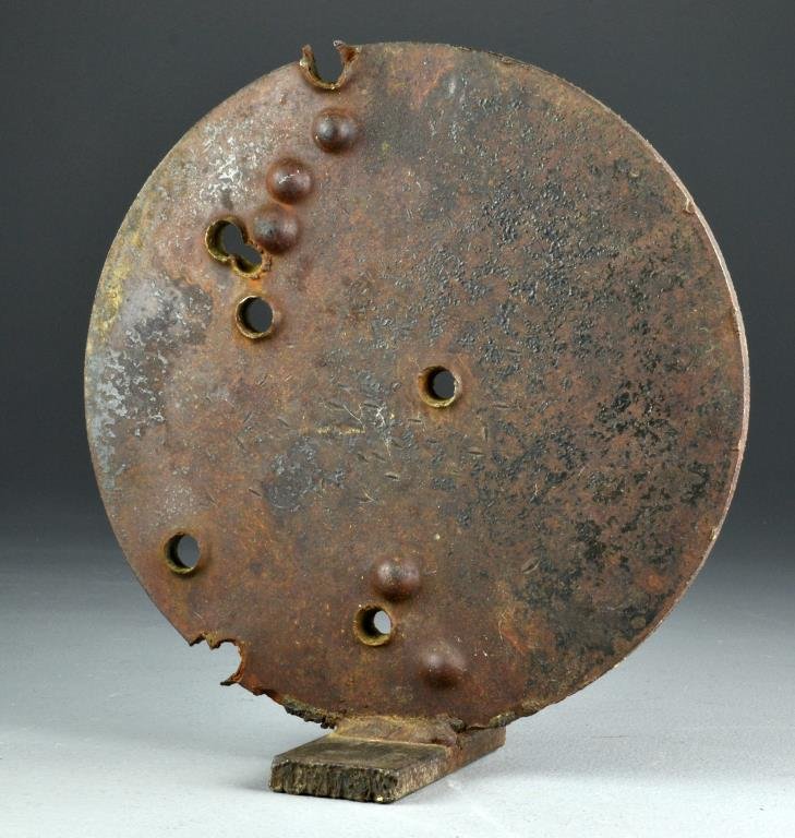Contemporary Iron Sculpture: Of disc form having random perforations throughout affixed to cast iron stand, 11"D, circa 20th century. Provenance: Formally in the collection of Gary Culpepper of Culpepper Galleries-Santa Fe, New M