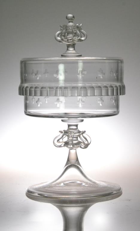 Blown Glass Covered Chalice: Beautifully designed hand-blown clear glass chalice with broad round footed base, etched crossed throughout, scalloped cut rim, pulled thread finial, 9.5" H, circa 20th century. Condition: good. Trust