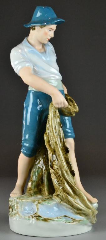 A Fine & Large Royal Dux Porcelain Figurine: Depicting a standing fisherman holding his net, finely painted and beautifully glazed, bares the Royal Dux pink triangular plaque, and additional impressed numbers, and additional stamps. 21," early t