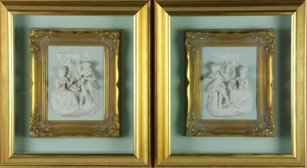 Pr. Dresden Bisque Porcelain Wall Plaques: Each depicting a lady being serenaded by a gentleman courter, both with nice gilt wood frames, now hung in a shadow box behind glass, measuring 22.25"h X 19.75"W overall. Property from Ethel Miller Si