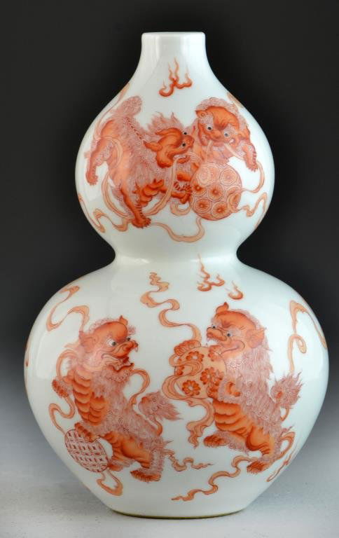 Chinese Iron Red & White Double Gourd Vase: Finely painted to depict foo lions at play, raised on short foot ring base bearing six character Guangxu mark in underglaze red, 9"H. Private collection Troy, Michigan.