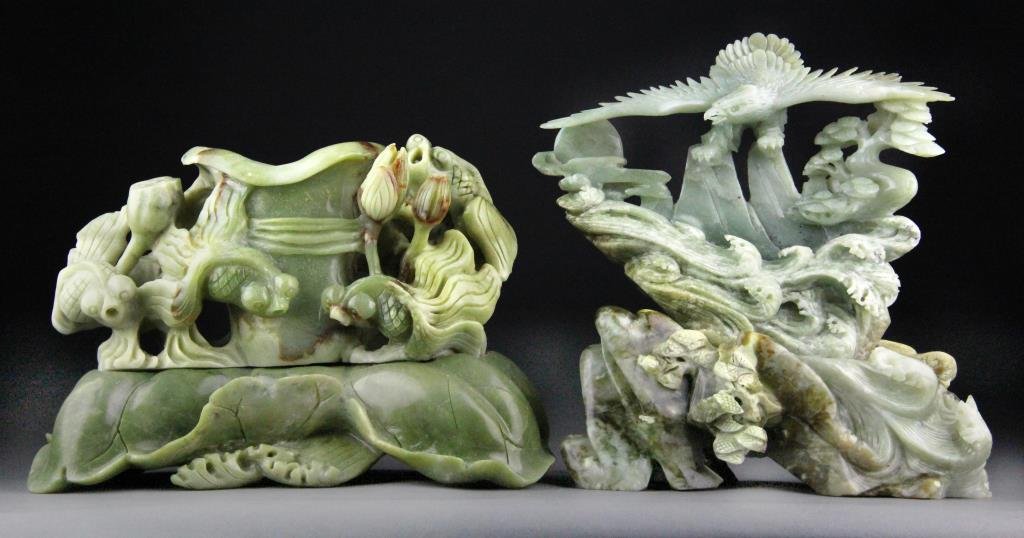 (2) Chinese Jade Carvings of Eagle and Goldfish hh: Finely carved jades, one to depict a soaring eagle above waves and the other to depict popeyed goldfish and lotus pods and pads, largest is 9" H x 8.5" L including base, circa 20th century, good condi