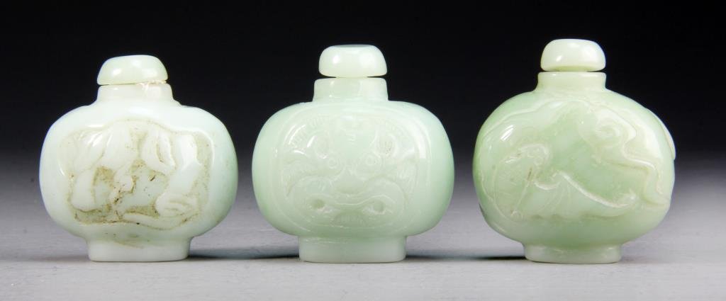 (3) Pcs Chinese Jade Snuff Bottles: Finely carved to depict bats in mountain landscape, face of the beast, and leaves, largest measures 2.25"H.
