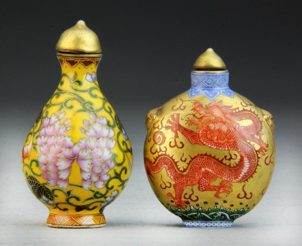 (2) Pcs Chinese Porcelain Snuff Bottles: Each finely decorated, one depicting a dragon and a phoenix amongst ruyi clouds, the other depicting lotus blossoms and tendrils, both having fine gilt decoration and having seal mark to base in iron 