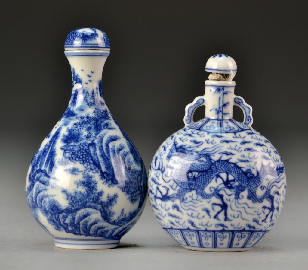 Pr. Chinese Blue & White Porcelain Snuff Bottles: One painted to depict a landscape with seal mark to under side, the other depicting a dragon amongst ruyi clouds and having three character mark to underside, largest measures 2.75"H.