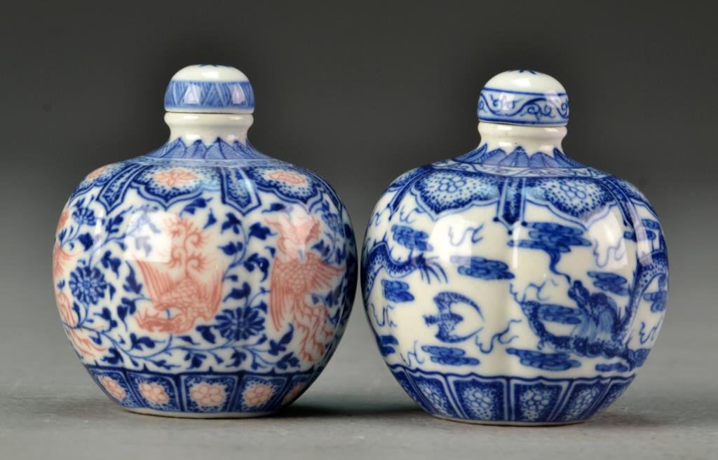 Pr. Chinese Blue & White Porcelain Snuff Bottles: To include two blue and white porcelain snuff bottles one painted to depict dragons amongst ruyi clouds and bearing three-character mark in underglaze blue to base, the other painted to depict phoenix