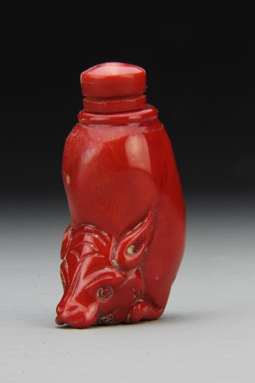 Chinese Carved Coral Snuff Bottle: Finely carved to depict head of bat at base, having smooth polished surface, great condition, complete with matching stopper and spoon, 2.75"H. From the collection of David Bell who worked for an Ital