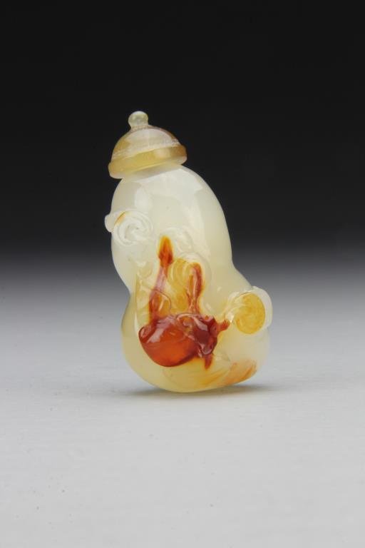 Chinese Carved Agate Snuff Bottle: Having gourd form, finely carved to depict bat, complete with matching stopper, 2.3"H. From the collection of David Bell who worked for an Italian steel company in China during the 1980's.